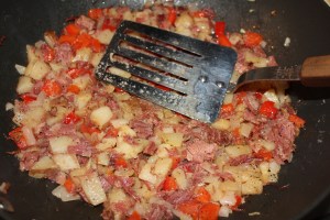Add corned beef and potatoes
