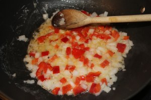 Saute onions and red peppers in butter
