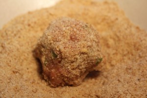 Roll turkey meatball in breadcrumbs