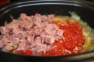 Add corned beef and tomatoes