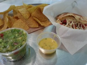 Pork Arepa with a side of Guasaca and chips