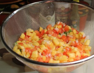 Drain pineapple and tomatoes
