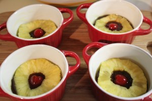 Place pinapple and cherry in ramekin