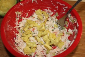 Add avocado to crab salad