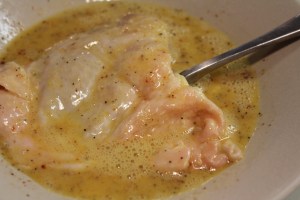 Dip chicken in egg mixture