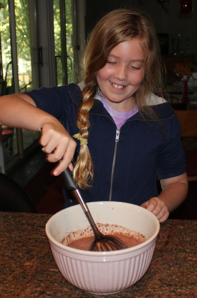 Lexi stirring the pudding