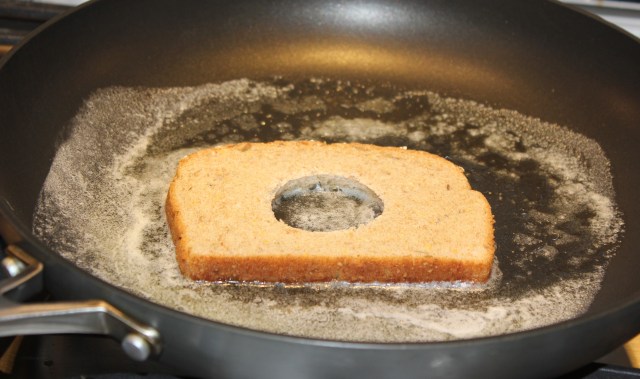 Place bread in melted butter