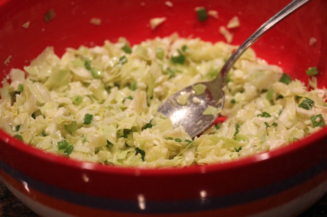 Combine dressing and cabbage, etc.