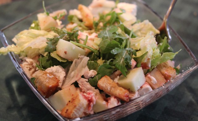 Kel's salad with arugula, turkey, goat cheese, apples, etc.