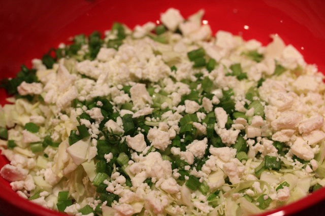 Mix cabbage, onions and feta