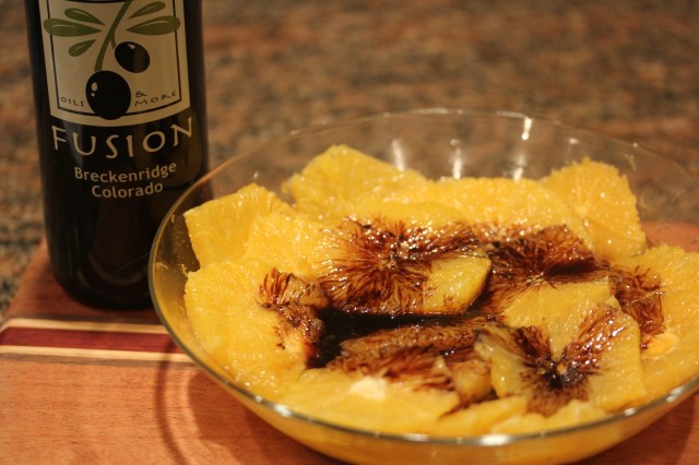 Add raspberry balsamic to orange slices