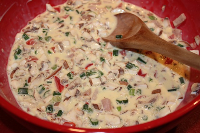 Add veggies and meat to egg mixture