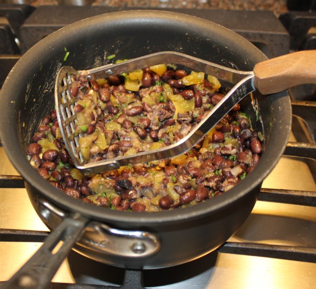 Heat and smash the black beans