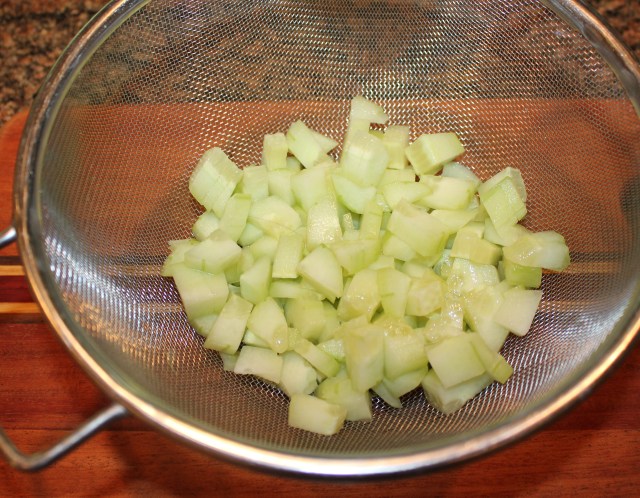 Place cucumbers in colander