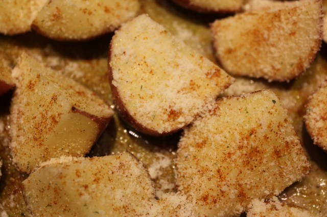 Season potatoes with garlic salt, cayenne and parmesan