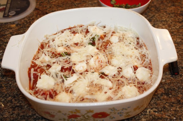 Add cheeses to eggplant and marinara