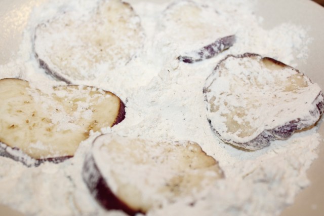 Dredge eggplant in flour