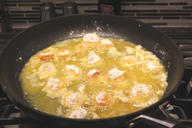Place coated shrimp in hot oil