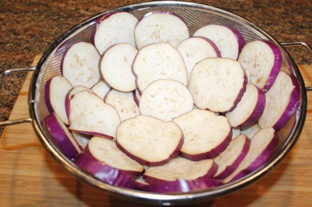 Place eggplant in colander
