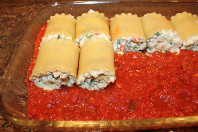 Place lasagna roll-ups on marinara
