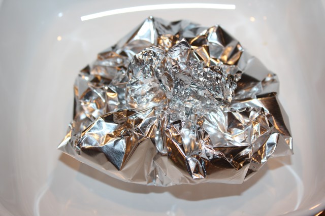 Surround garlic with foil