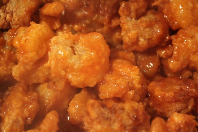 Toss fried shrimp with buffalo sauce