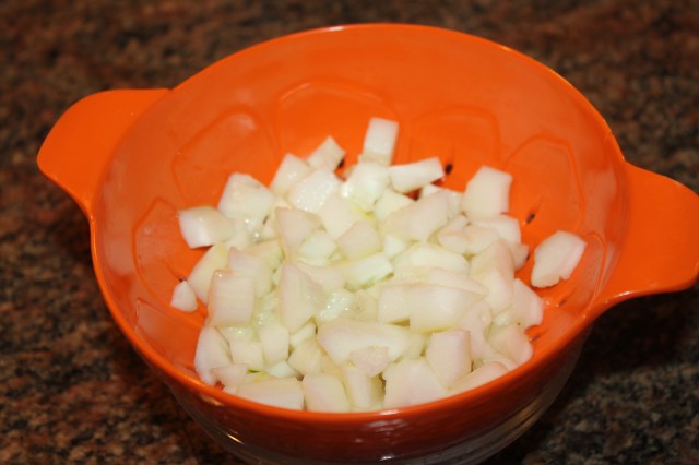 Drain cucumber in colander