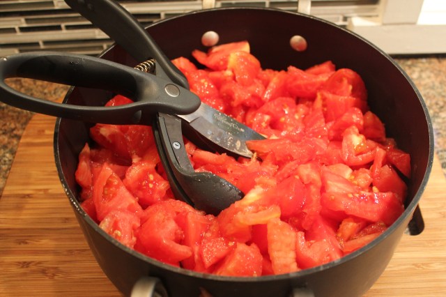 Chop up tomatoes for the marinara sauce