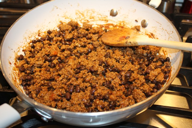 Add beans and taco seasoning to ground beef