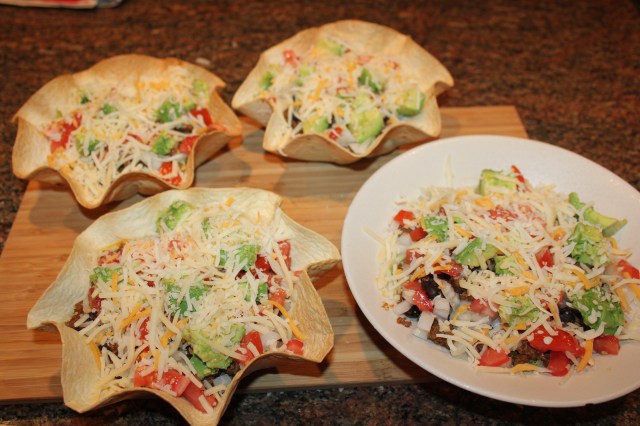 Fill tortilla (and regular) bowls with taco ingredients