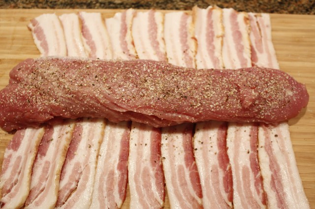 Place tenderloin on bacon
