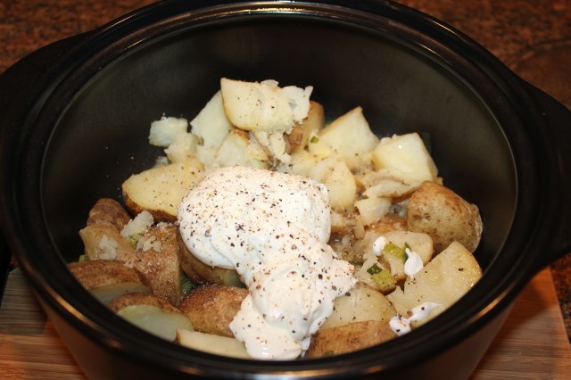 Add yogurt to cooked potatoes