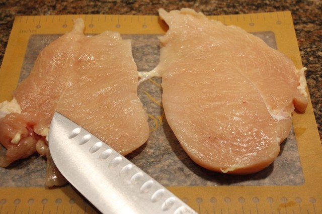 Slice chicken breast in half