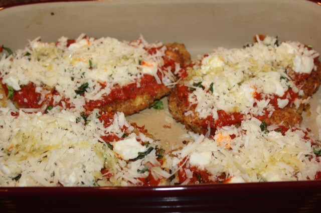 Sprinkle chicken with cheeses and basil