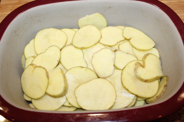 Place potatoes in PC deep covered baker