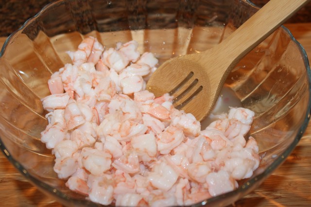 Combine shrimp and lime juice