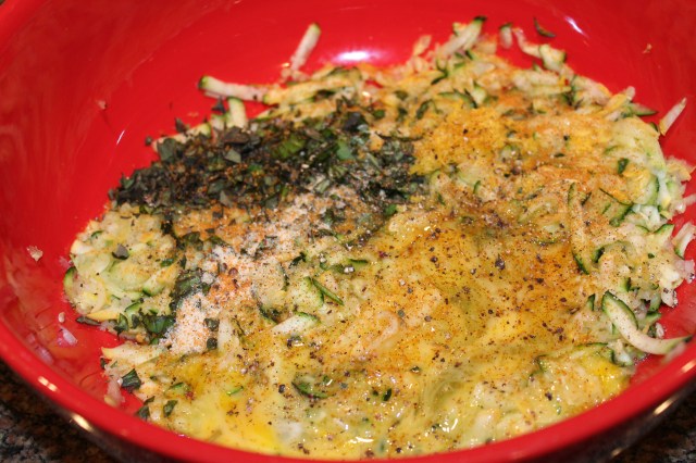 Add eggs, herbs, etc. to zucchini mixture