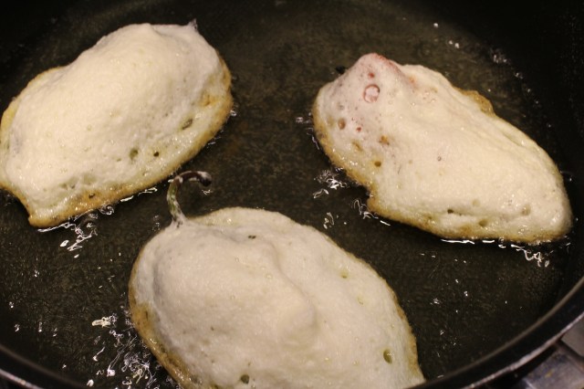 Place poblanos in hot oil