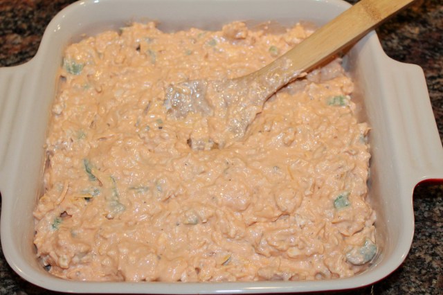 Spread buffalo chicken dip in shallow baking dish