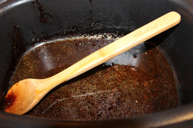 Add beef broth and sesame oil to slow cooker