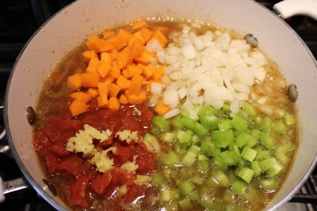 Add tomatoes, carrots, celery, onion, potatoes, garlic