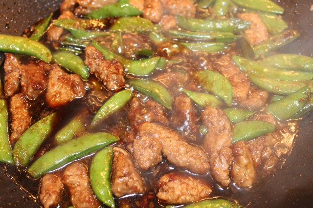 Add sauce to beef and snow peas