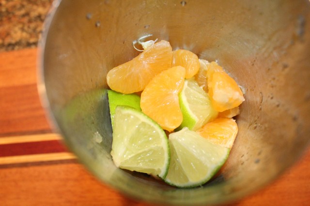 place-limes-and-clementines-in-shaker