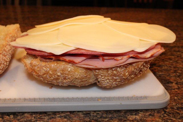 Add some cheese to Kel's muffulettas