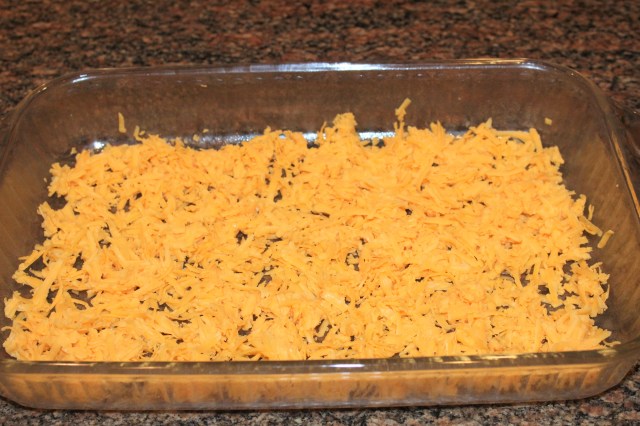 Spread cheddar in casserole dish