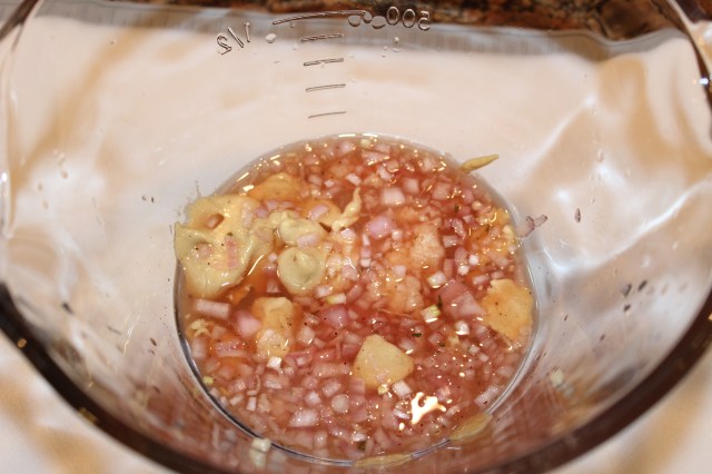 Place vinegar, shallots, dijon, etc. in a bowl.