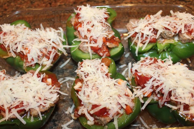 Sprinkle peppers with parmesan romano