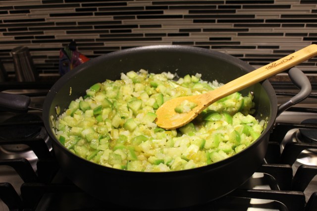 Saute tomatillos and peppers