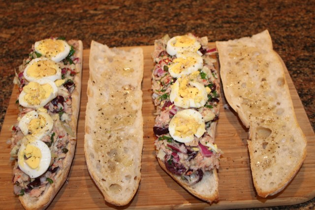 Top Kel's Tuna Bagnat with boiled egg slices