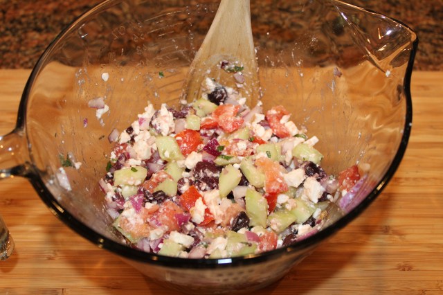 Mix veggies and cheese for Kel's barley salad
